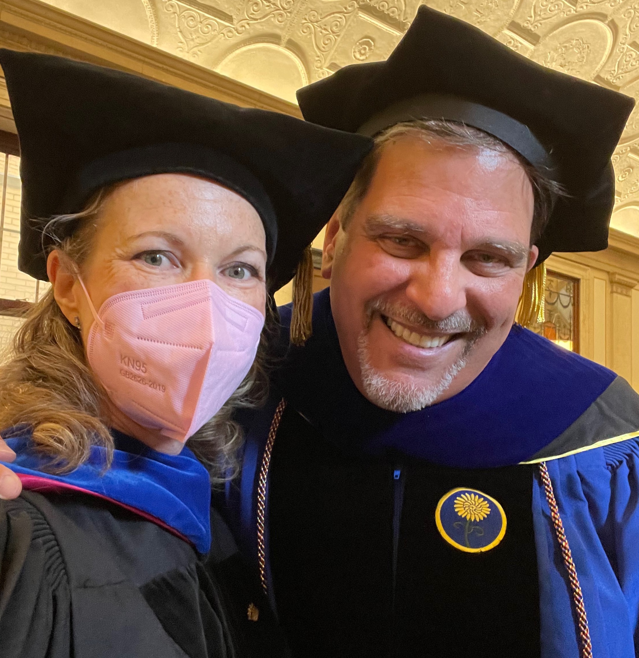 Dr. Jayne and Dr. Michael at his PhD graduation, in their regalia